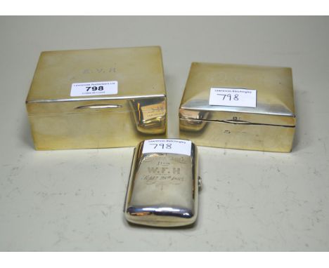 Two rectangular silver cigarette boxes and a silver cigarette case