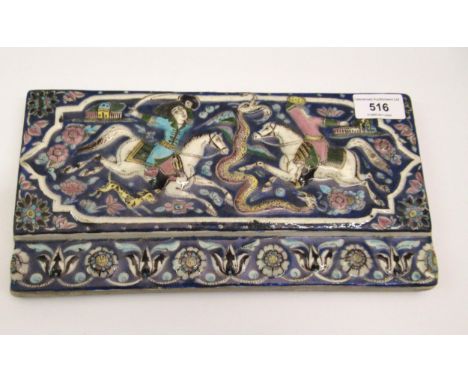 Antique Persian tile relief and enamel decorated with figures fighting on horseback, 15 x 28.5cmDamages as shown in photos