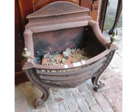 Modern cast iron fire grate with brass finials