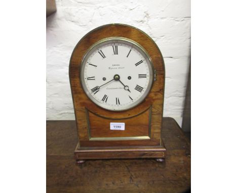 Regency rosewood and brass mounted bracket clock, the dome shaped case with bun feet, the circular painted dial with Roman nu