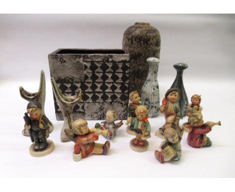 Small quantity of various Goebel figures of children, three pottery items, and a salt and pepper in the form of catsSome dama