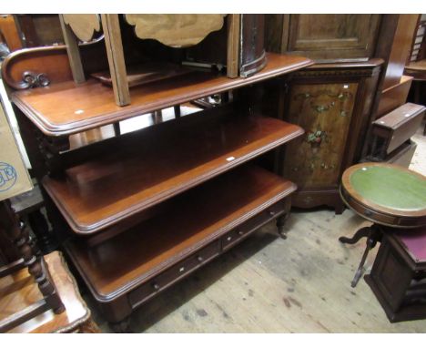 Victorian mahogany three tier buffet with a shaped back above open shelves and two drawers, 135cm wide x 53cm deep x 147cm hi