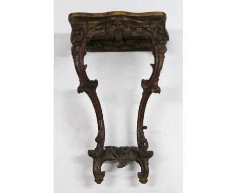 Small antique carved oak console table, the pine top above cabriole supports, 56 x 82cm