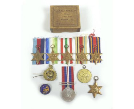 A group of seven WWII medals, comprising an Africa Star, Atlantic Star, Burma Star, Italy Star, 1939-45 medal all with ribbon