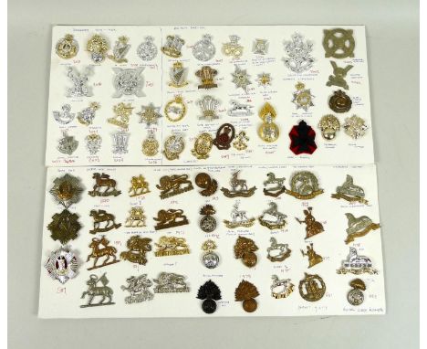 A collection of seventy three British military badges, including the Royal Marine Light Infantry, Royal Fusiliers, Lincolnshi