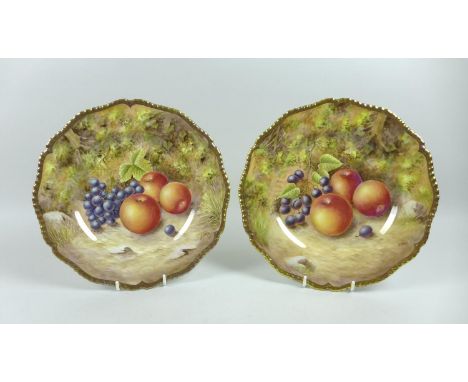 Two modern Royal Worcester cabinet plates, hand painted by N. Creed, each with a fruit study to a mossy background, shaped gi