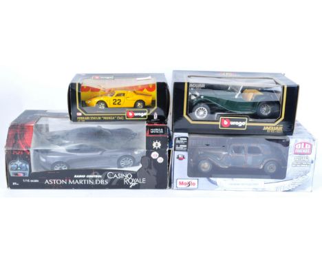 A collection of x4 assorted large scale boxed diecast model cars comprising; 1/16 James Bond Casino Royale Aston Martin DBS, 