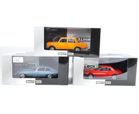 A collection of x3 assorted ' Whitebox ' made 1/24 scale diecast model cars comprising models No. WB124039 Jaguar E-Type, WB1