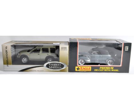 Two boxed 1/18 scale diecast model cars comprising Ertl Collectibles ' Grandes Marques ' model No. 40602 Freelander V6 and Un