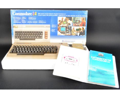 An original vintage Commodore 64 computer / games console, housed within its original box with the power pack and accompanied
