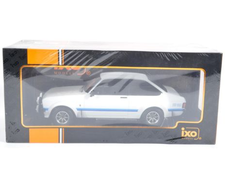 An original ' IXO Models ' 1/18 scale factory sealed diecast model No. IXO18CMC029 Ford Escort MK II RS 1800 1977. Highly det