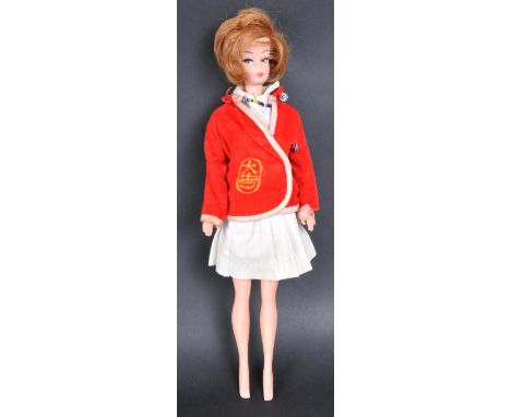 Barbie - an original vintage 1960s Mattel made Barbie doll. Brown short hair, with eyes facing right. Retains an original out