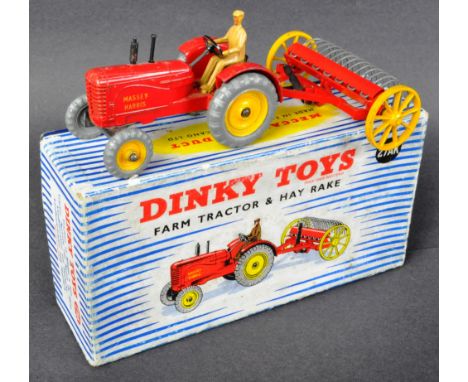 An original vintage Dinky Toys diecast model No. 27AK Farm Tractor and Hay Rake. The Massey Harris tractor and rake appearing