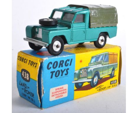 An original vintage Corgi Toys diecast model No. 438 Land Rover 109" W.B with khaki green body work, spring suspension and de