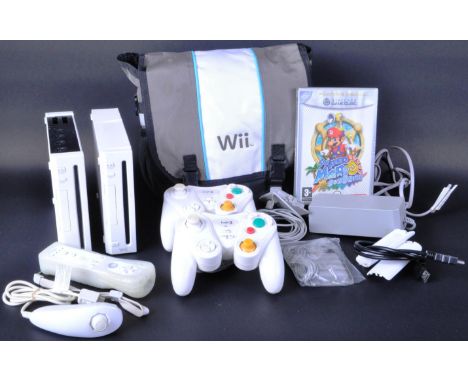 Two Nintendo Wii video games consoles with a Wiimote and Nunchuck controller set, x2 third party Logic 3 Gamecube controllers