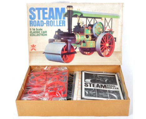 An original vintage Japanese Bandai made 1/16 scale plastic model kit No. 35360 Steam Road Roller. The contents appearing sea