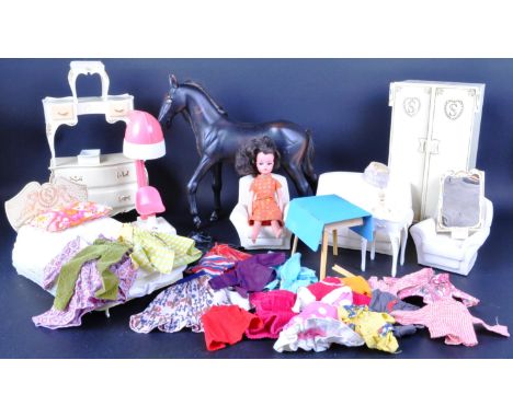 An original vintage circa 1970's Pedigree made Sindy doll with a selection of original Sindy (and other) clothing and Sindy H