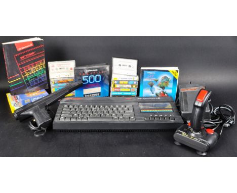 A original vintage Sinclair made ZX Spectrum computer video game console with games and accessories comprising a 128K +2 mode