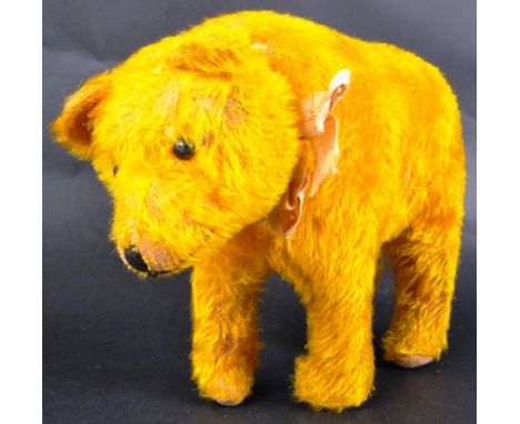 An early 20th Century believed Steiff made soft toy teddy bear. Golden mohair with black wooden eyes, stitched nose and artic