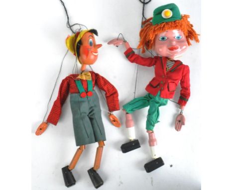 Pelham Puppets - two original vintage Pelham Puppets, comprising; an early long-head Type SS Pinocchio puppet with original o