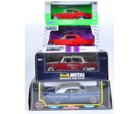 A collection of x4 assorted large scale boxed diecast model cars to include; Revel Metal 1/18 scale 08942 Mercedes Benz 220 S