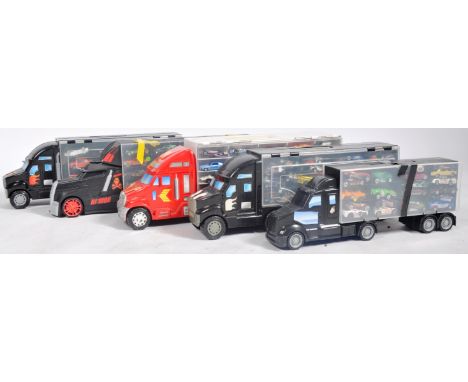 A large collection of Mattel made Hot Wheels diecast models contained within 5x truck shaped carry cases. Each carry case hav