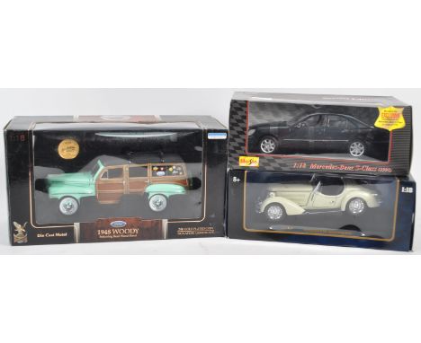 A collection of x3 assorted 1/18 scale boxed diecast model cars comprising Ricko ' Wanderer WK25 Roadster ' (1936), Road Sign