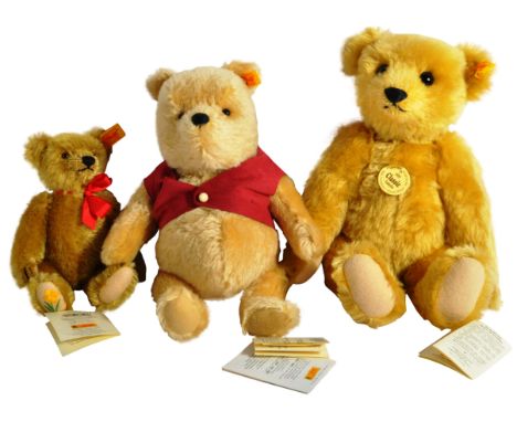 A collection of x3 original German Steiff made soft toy teddy bears to include; 354410 Winnie The Pooh dressed in a red shirt