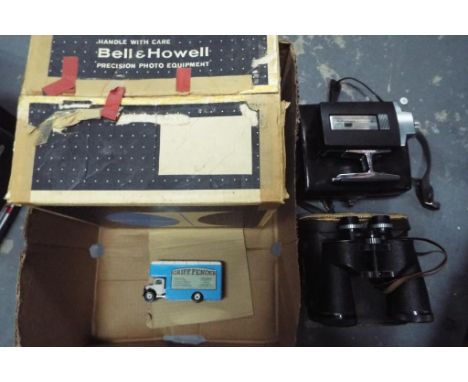 A Bell &amp; Howell super 8 projector (boxed), Bell &amp; Howell super 8 camera (in case), Greenkat 7 x 50 binoculars (in cas