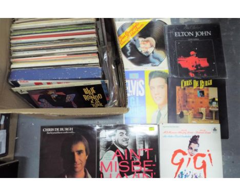 A large quantity of 33.3 rpm vinyl records to include Elvis, Elton John, Chris de Burgh, Frank Sinatra, Shirley Bassey and si