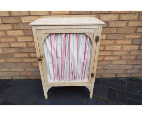 An antique pine larder cupboard with a lead fitted base and one shelf approx 90cms x 60cms x 36cms 