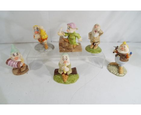 Six ceramic Royal Doulton figurines from the Snow White collection entitled Sleepy SW15 Doc with Light SW19, Happy SW12, Snee