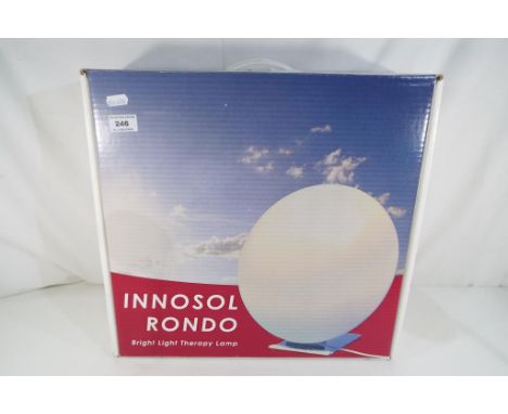 An Innosol Rondo Bright Light therapy light, boxed