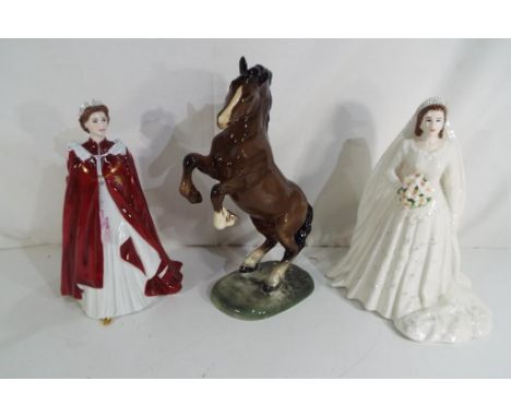 A lot to include a Beswick ceramic figurine depicting a rearing horse, impressed marks to the base #1014, approximately 26 cm