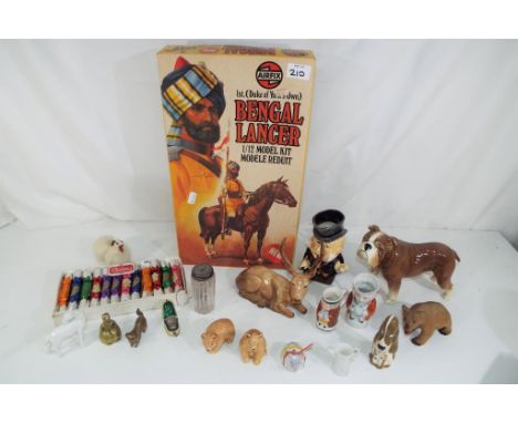 A good mixed lot to include a Sylvac bulldog No. 16, Beswick figurine, a Burleigh ware character jug, a carved wooden bear, a