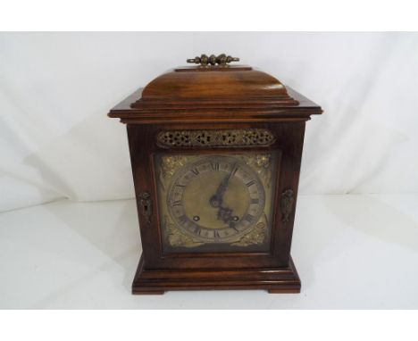 A mid-20th century English bracket or table clock in the 18th century caddy-top style, the square brass dial having applied, 