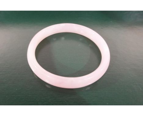 A jade bangle. Estimate £20 - £30