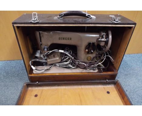 A vintage Singer sewing machine in carry case