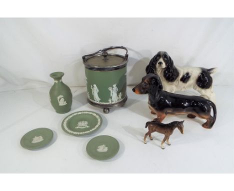 A lot to include five pieces of Wedgwood green Jasperware, a Beswick figurine of a dachshund, a Beswick figurine depicting a 