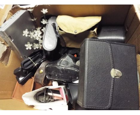 A quantity of vintage cameras and binoculars to include Olympus OM10, Box Brownie, Omija 8 x 40 zoom binoculars and similar