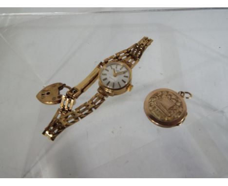 A lady's wristwatch, Rotary quartz, the case, bracelet and padlock clasp all hallmarked 9 carat gold, approx 13.51 gm (all in