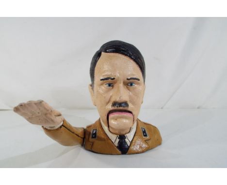 A cast metal nutcracker in the form of Hitler. Estimate £20 - £30