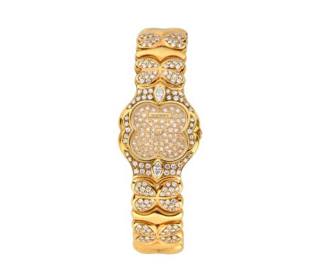 A gold and diamond set quartz bangle watch Quartz movement, diamond set quatrefoil dial, vari-cut diamond set bezel, with dia