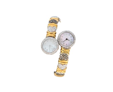 A two colour gold, diamond and brown diamond duo-dial sprung bangle watch  Circa 1990 Each watch with quartz movements set to