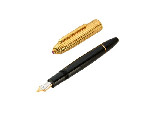 A gold and ruby set fountain pen  Black resin barrel and gold cap with a cabochon ruby terminal, Montblanc nib 14.3cm length 