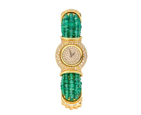 Swiss. A diamond and emerald set quartz bangle watch Quartz movement, pavé diamond set dial and domed case, sprung bangle str