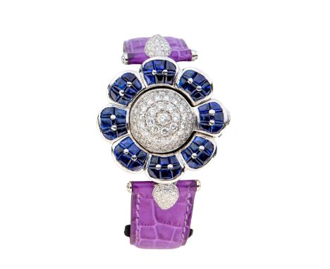 Swiss. A sapphire and diamond set quartz wristwatch Quartz movement, silvered dial, facetted crystal, domed diamond set hinge