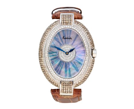 Kutchinsky. A diamond and brown diamond set oval cased wristwatch  Iceberg, Circa 1990 Quartz movement, mother of pearl dial 