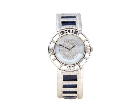 Swiss. A white gold diamond set bangle watch Romus, Circa 1990 Quartz movement, mother of pearl and pavé diamond dial with bl