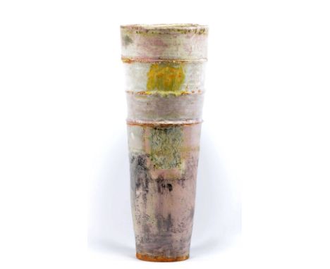 ROBIN WELCH (born 1936); a tall tapered stoneware vase covered in bands of pink, white and grey glaze with rectangular panels